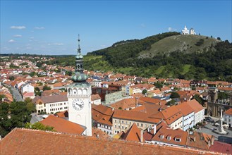 View from the border tower of the chateau to the old town with St. Wenceslas Church and view to the Holy Mountain Svaty kopecek