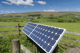 Solar panels on farm used to operate electric gate along farm track. Lancashire