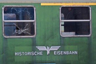 Green railway wagon on siding