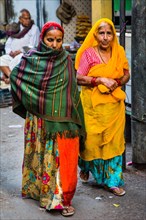 Women in colourful lehenga cholis