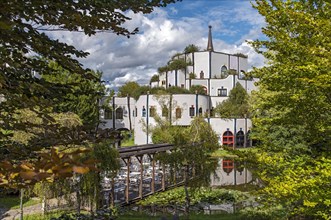 Colourful building and pond at Rogner Thermal Spa and Hotel designed by Hundertwasser