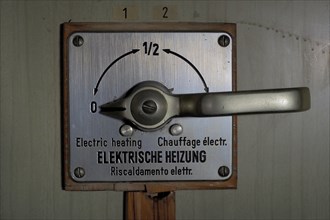 Lever of an electric heating in a railway carriage