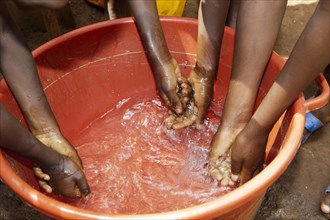 Children washing their hands in fresh