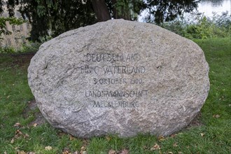 Memorial stone of the Landsmannschaft Mecklenburg for the reunification of Germany on 3 October 1990 on the shore of the Schwerin Inner Lake near the Schwerin Castle