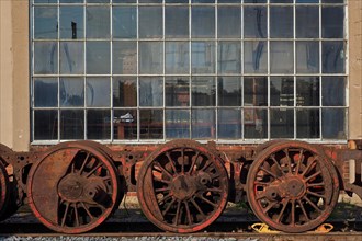 Rail wheels in front of workshop