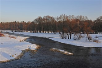 White winter landscape with trees on the Isar at the Flaucher