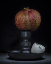 Still Life with Pomegranate on Ceramic Stand with Egg Shell