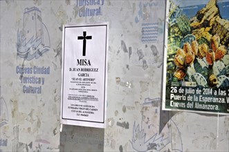 Announcement of a death on a wall