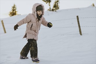 Girl trudging in the snow