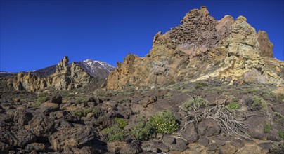 Colourful rocks of Roques de Garcia and Teide in the background