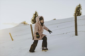 Girl trudging in the snow