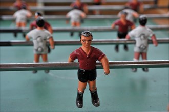 Figures on poles from table football