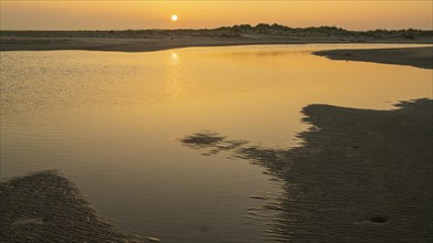 Sunrise on the beach of the North Sea