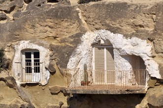 Cave flats with balcony on the rock