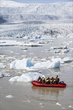 Excursion boat on the ice lagoon Fjallsarlon