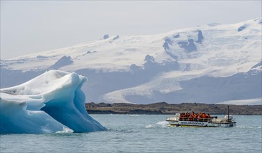 Excursion boat on ice lagoon Joekulsarlon