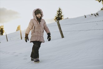 Girl trudging in the snow