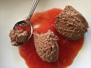 Dessert Chocolate mousse in red sauce