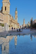 Reflection of the Baroque Basilica del Pilar in the Hispanidad Fountain