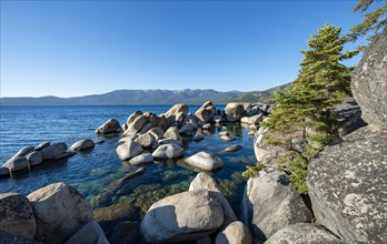 Lake Tahoe shore with round stones in the water