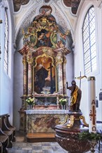 Side altar and baptismal font