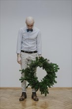 Man with fir wreath