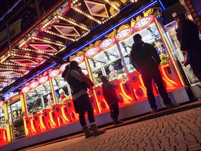 Colourfully illuminated slot machines at a fair