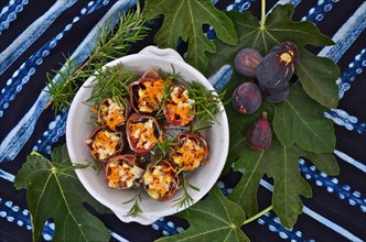 Red figs on leaf with ham wrapped roulades