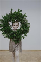 Girl with fir wreath