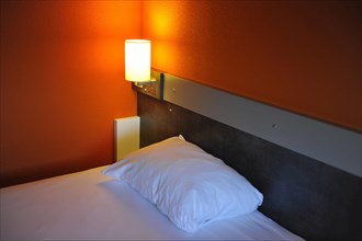 Bedside lamp and pillow Ibis Budget Hotel