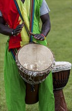 Musicians playing on an African djembe