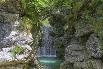 Cascata Rio Repepeit a small artificial waterfall with stone bridge