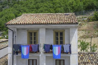 House with Italian flags on clothesline