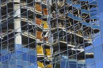 Construction reflection on facade of modern building
