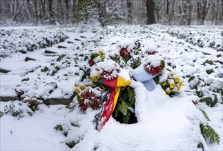 Funeral wreath covered with snow
