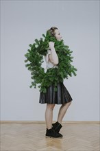 Woman with fir wreath