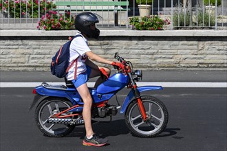 Teenager with tuned moped