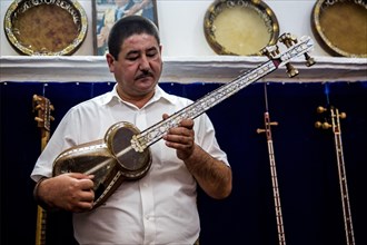 Musician with typical Uzbek musical instrument