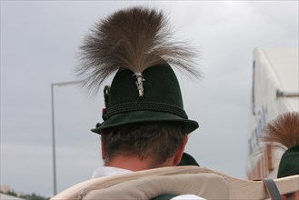 Man from behind with green traditional hat and chamois beard