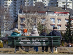 Seniors sitting on a park bench at the Segeluchbecken in the Maerkisches Viertel