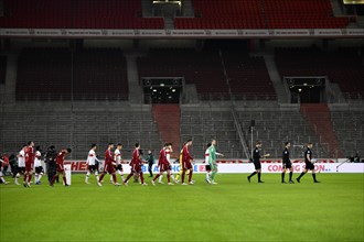FC Bayern Munich FCB and VfB Stuttgart teams enter the pitch in front of empty stands