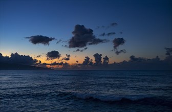 Sunset with clouds on the beach of Praia de Santa Barbara