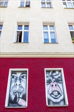 Creative graffiti with emotional statements on the facade of a youth psychiatrist's house