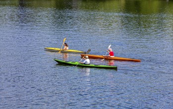 Recreational sportsmen with their kayak on the Havel