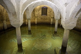 Flooded floor mosaic in the crypt of the Basilica di San Pietro Maggiore in San Francesco