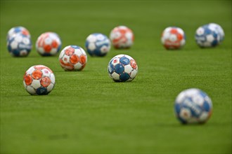 11 Adidas Derbystar match balls lie on the ground