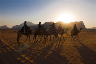 Tourist riding camels