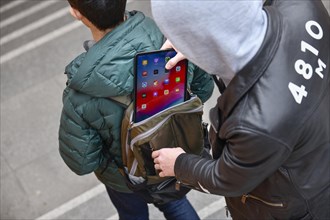 Theft of a tablet from a backpack