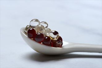 Aceto pearls in spoon