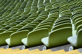 Green rows of chairs in the Olympic Stadium